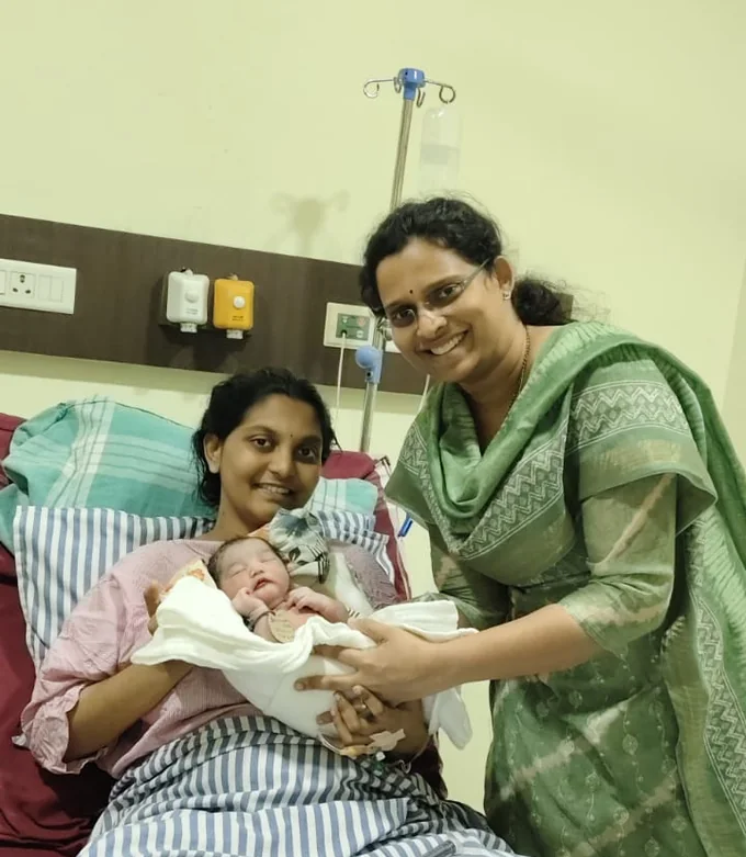 Dr. Sravanthi Kolli with a new mother and newborn at Ishanvi Superspeciality Healthcare, Visakhapatnam